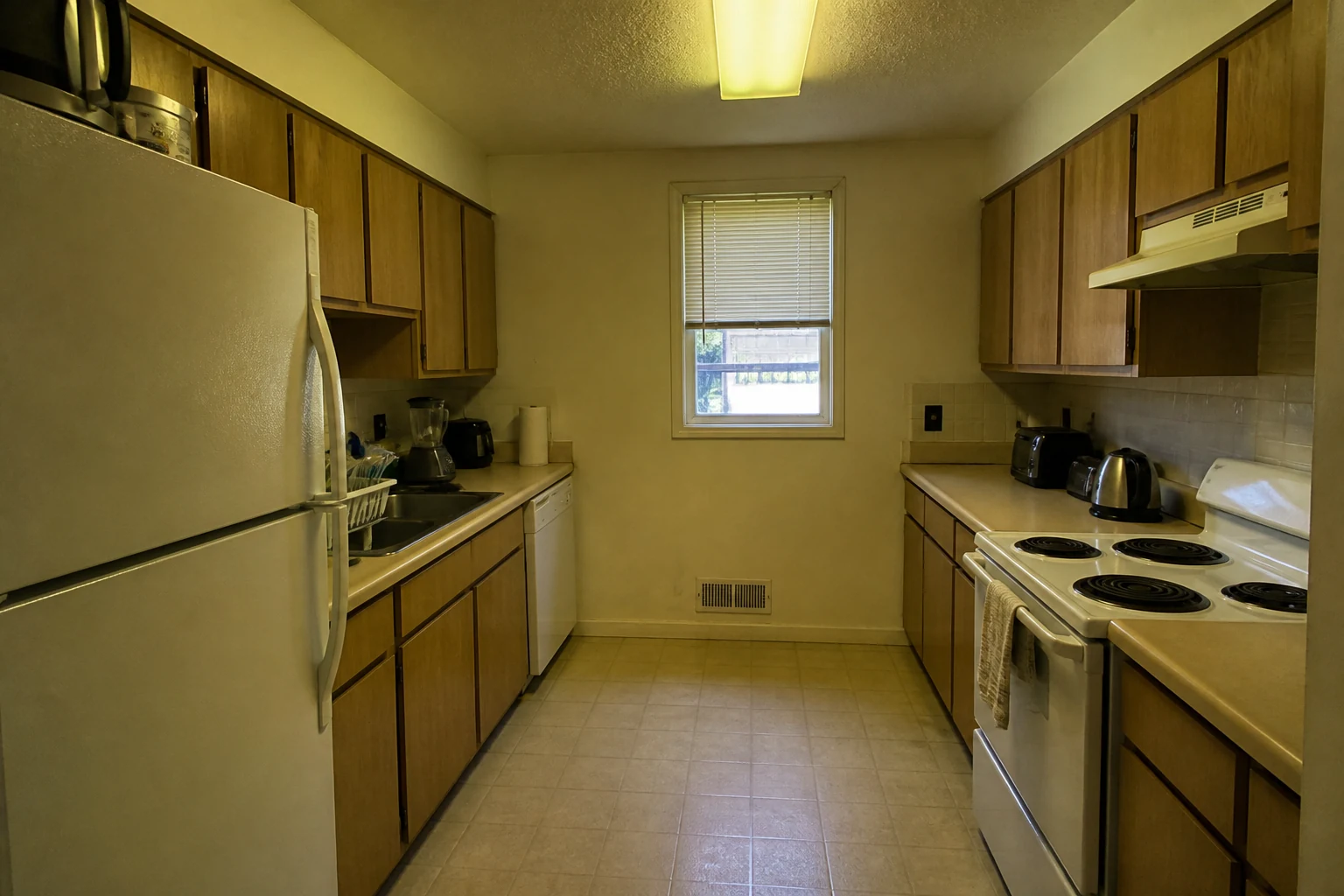 Noisy yellow kitchen photo before AI enhancement