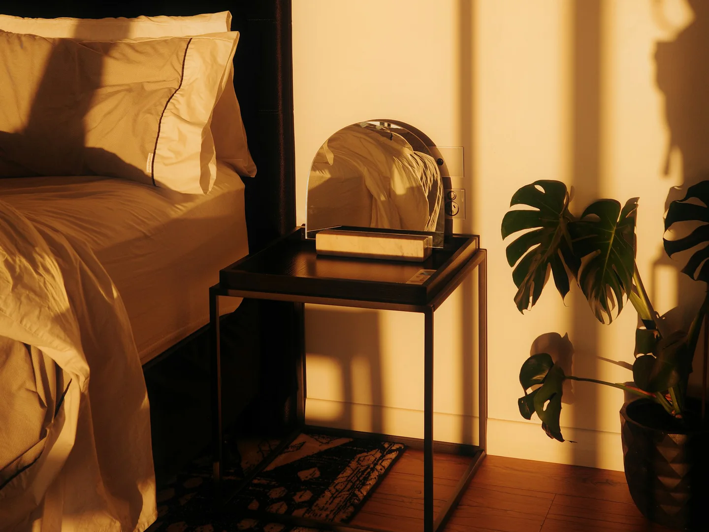 Bedroom corner illuminated by warm late afternoon sunlight