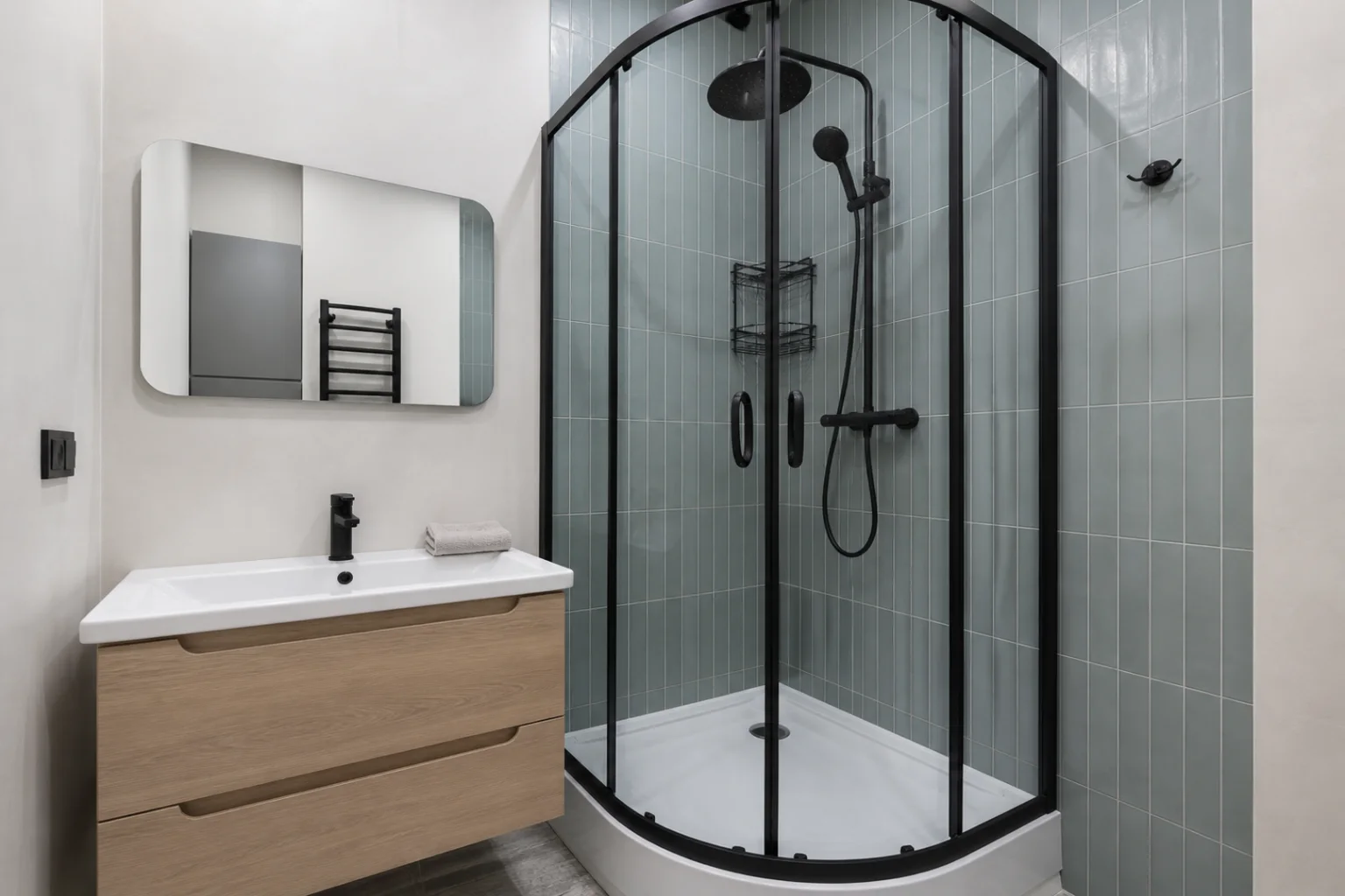 AI small bathroom design with blue-green tile and oak vanity