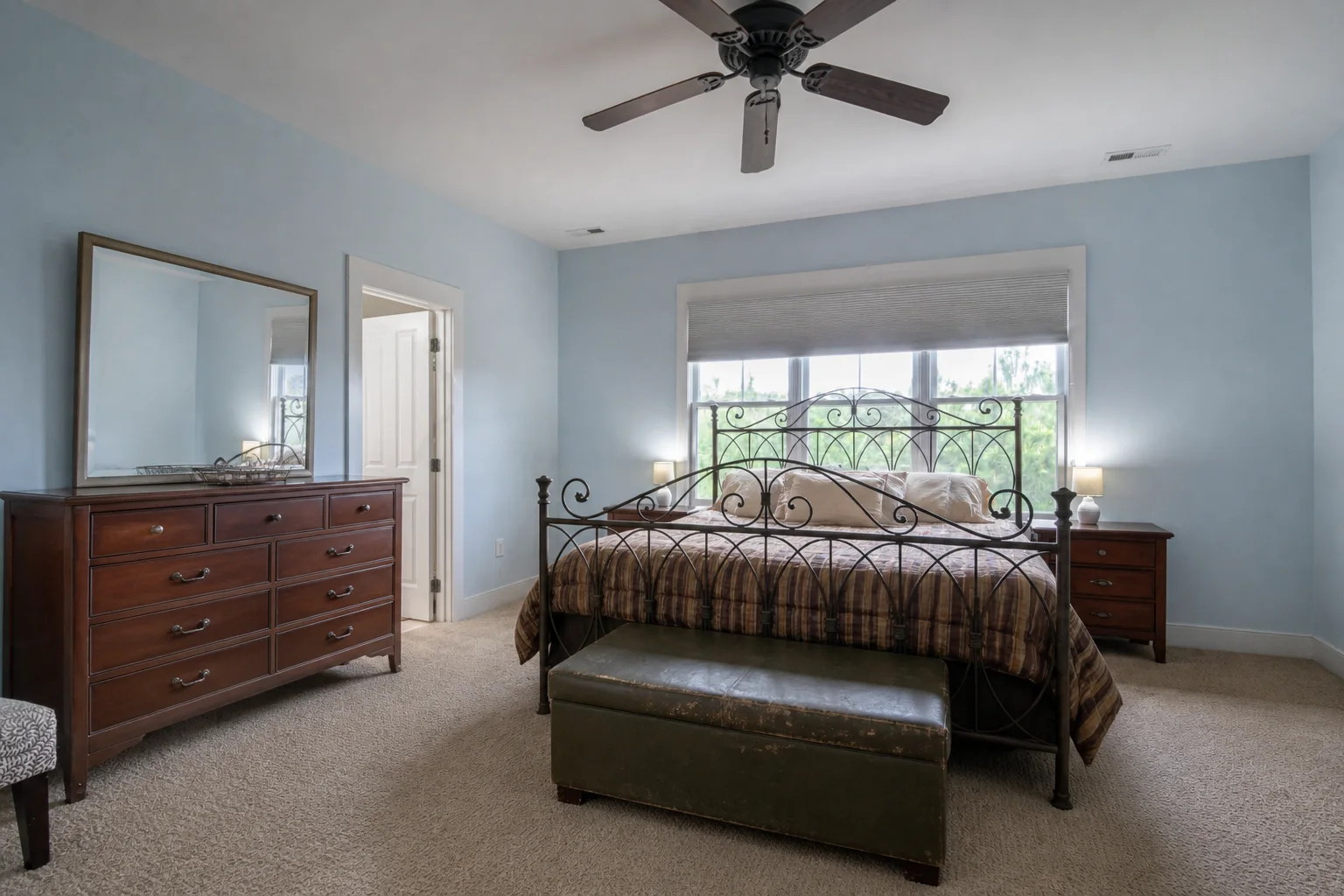 Dated primary bedroom before an AI bedroom design makeover