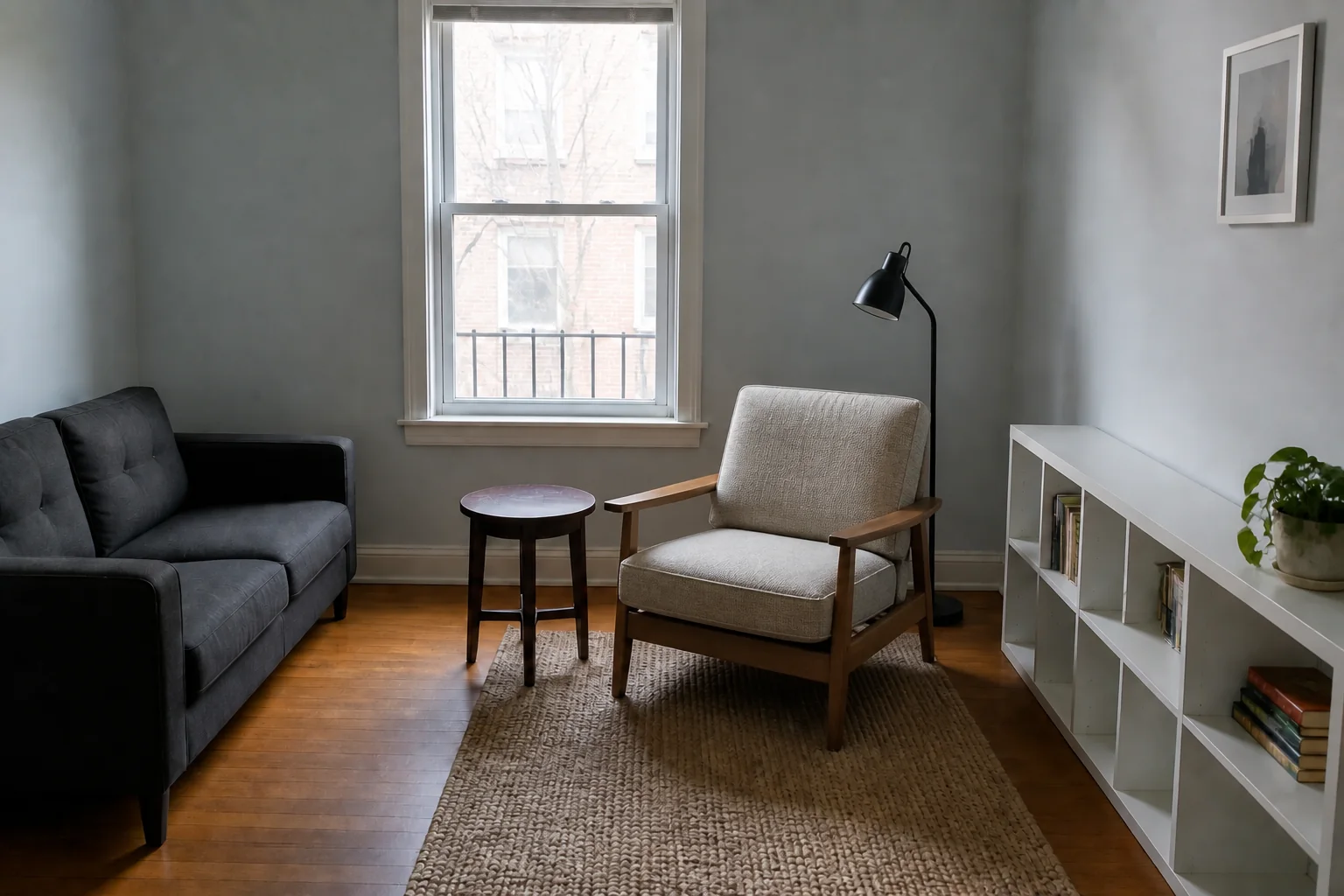 Same reading room after replacing only the mustard chair with an oak-frame lounge chair