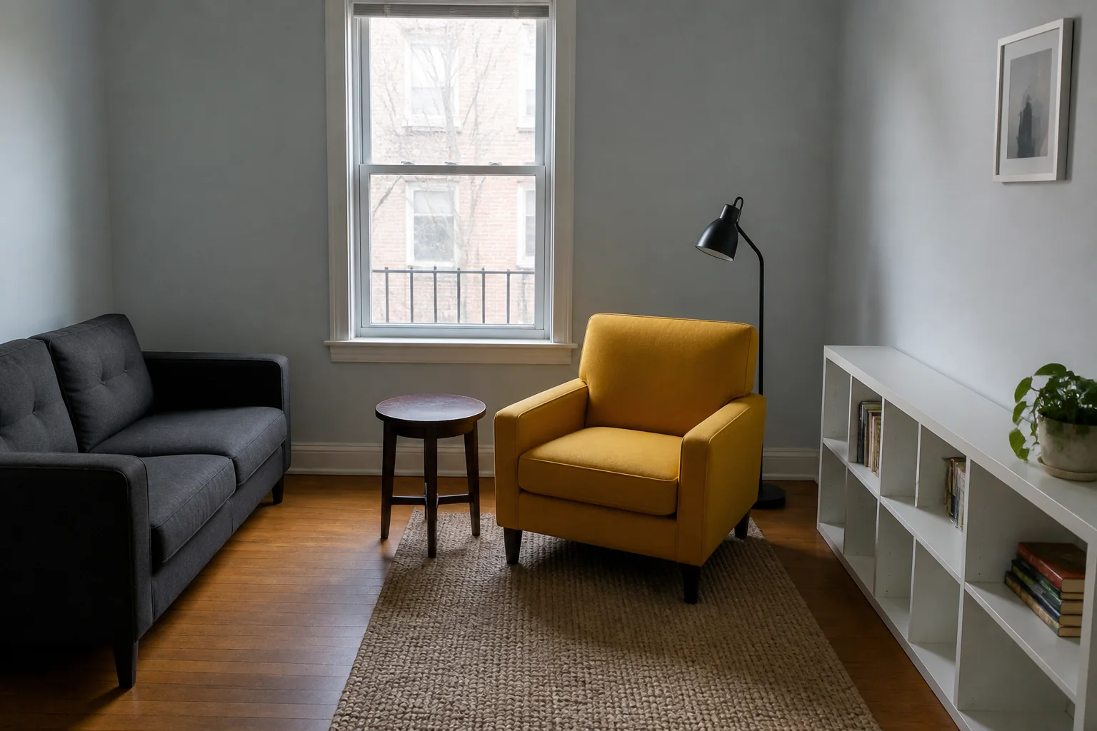 Small apartment reading room with a mustard armchair before a focused AI furniture edit