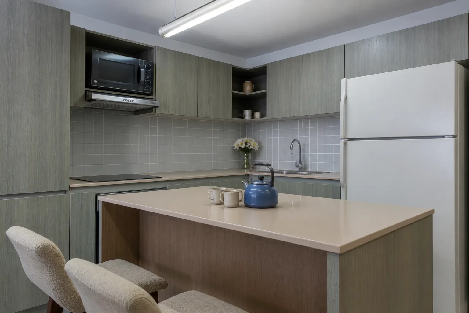 Compact gray laminate kitchen before an AI kitchen redesign