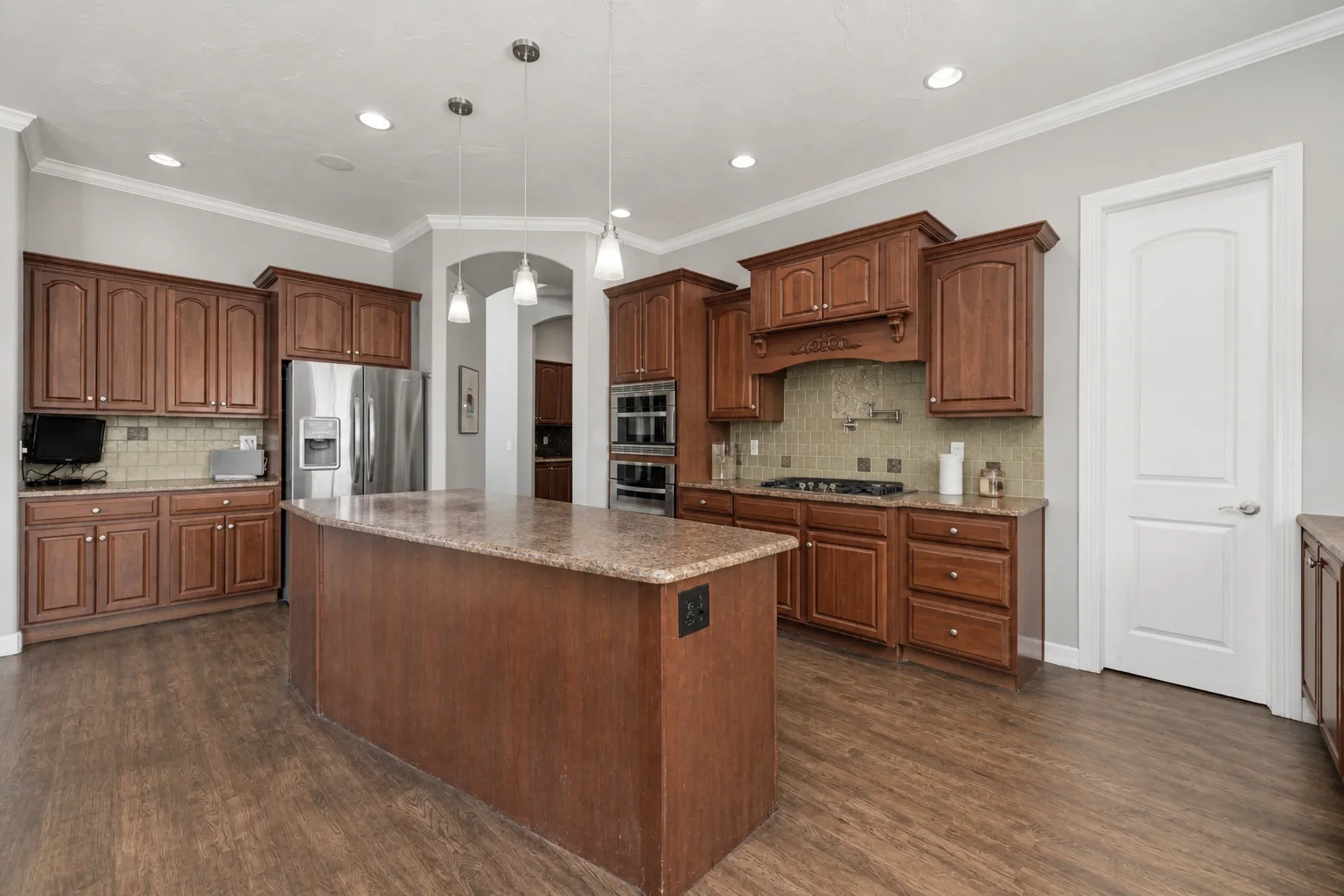Large ornate pecan kitchen before an AI kitchen design update