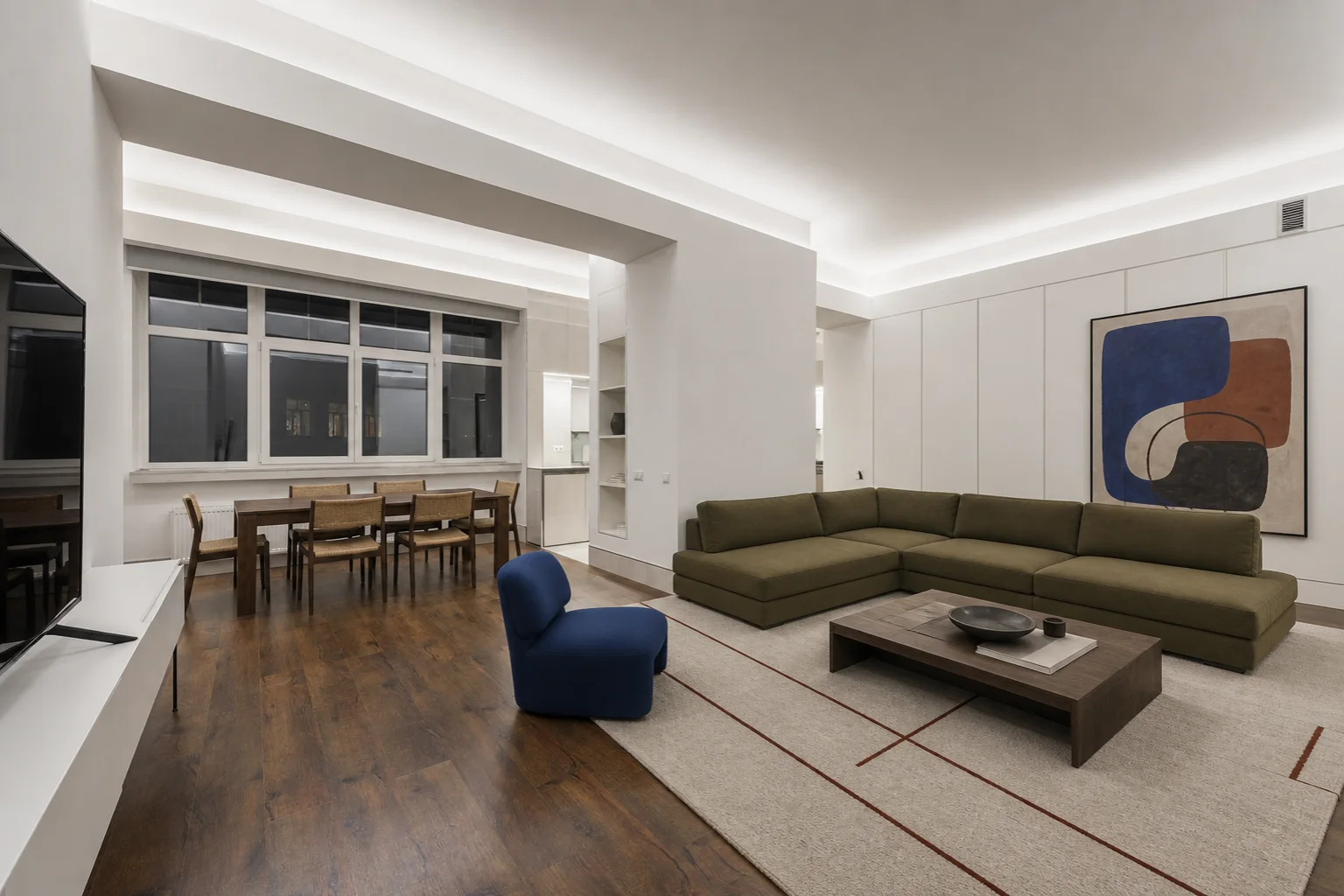 AI open-plan living room design with olive sofa and cobalt lounge chair
