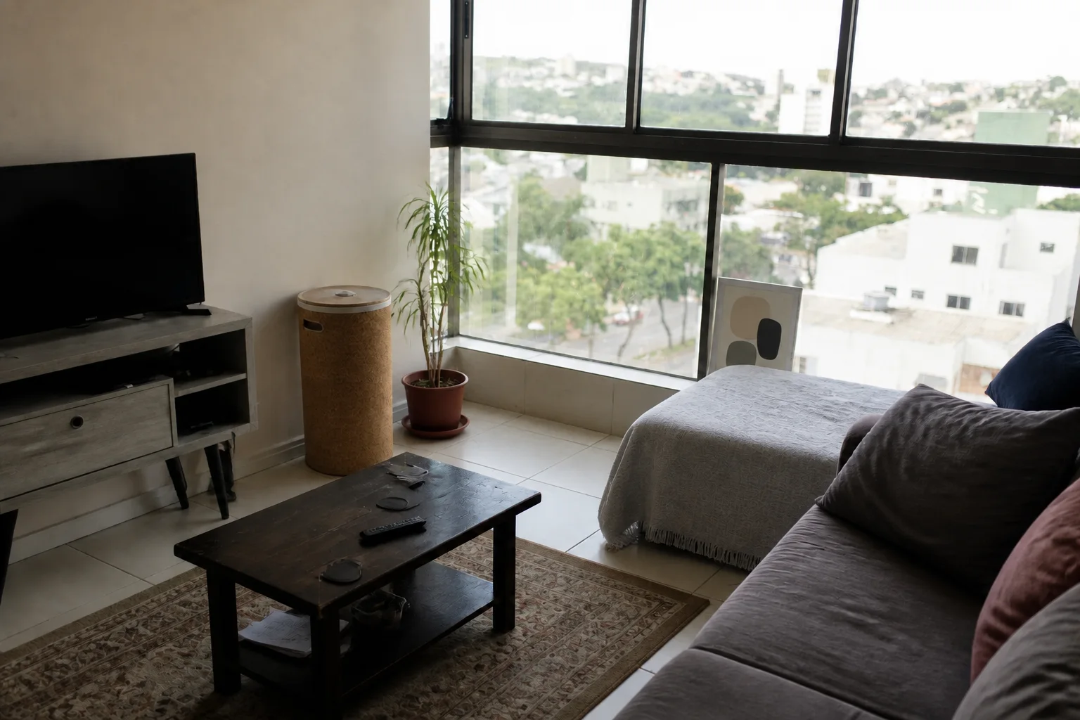 Compact apartment living room before an AI interior redesign