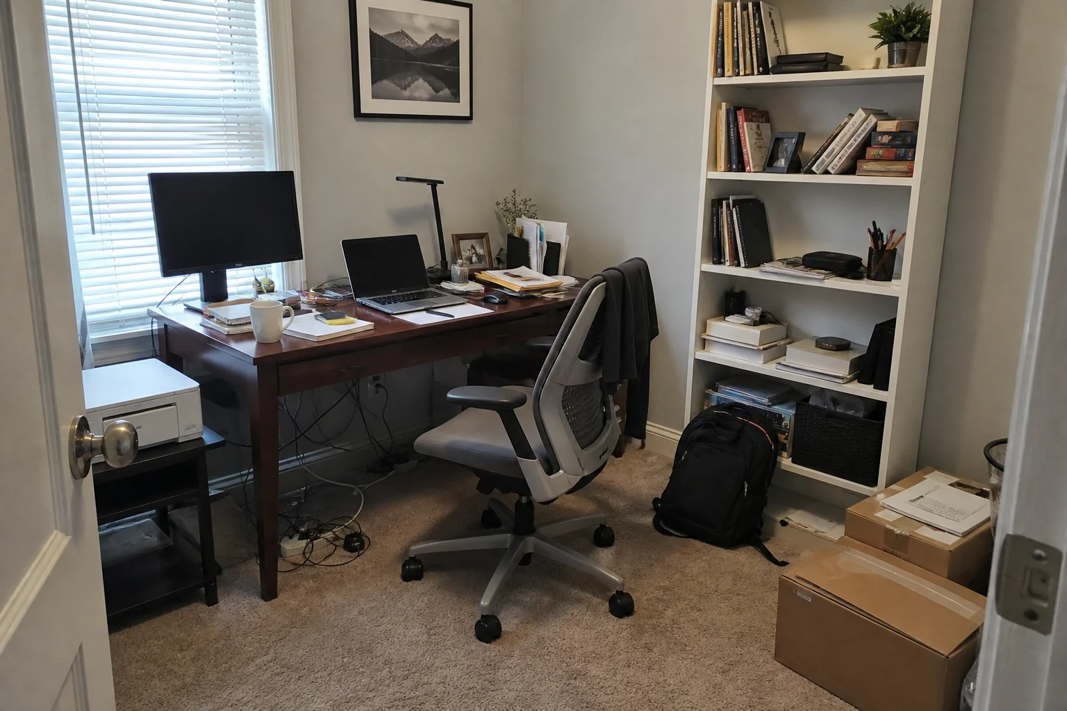 Messy home office with papers, boxes, backpack, and tangled cables before AI decluttering