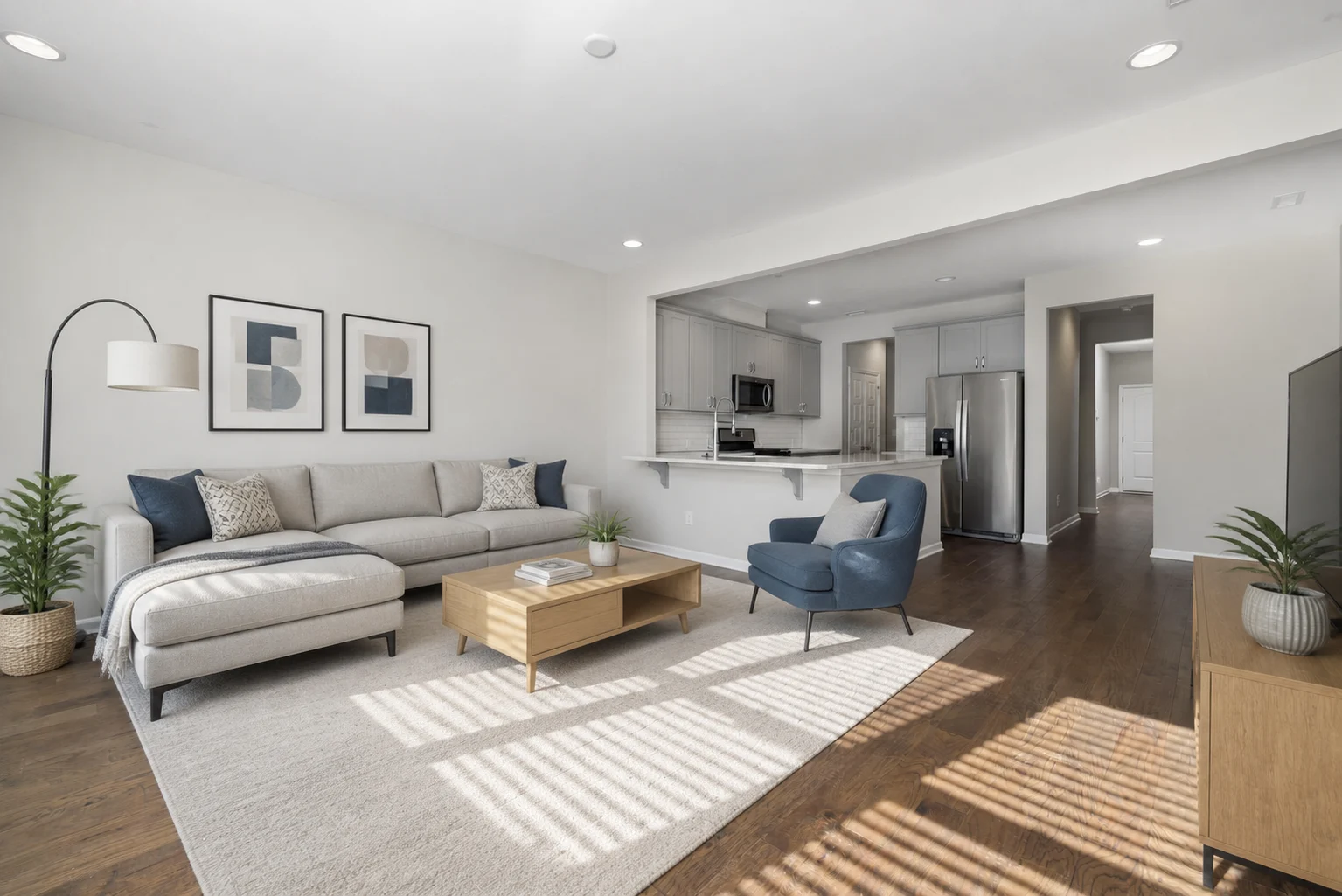 Contemporary AI room design with navy sofa, rust chairs, rug, and media storage