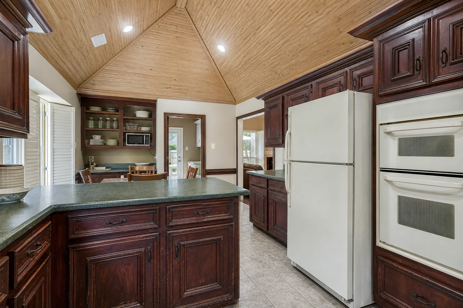 Dated dark wood kitchen before an AI kitchen makeover